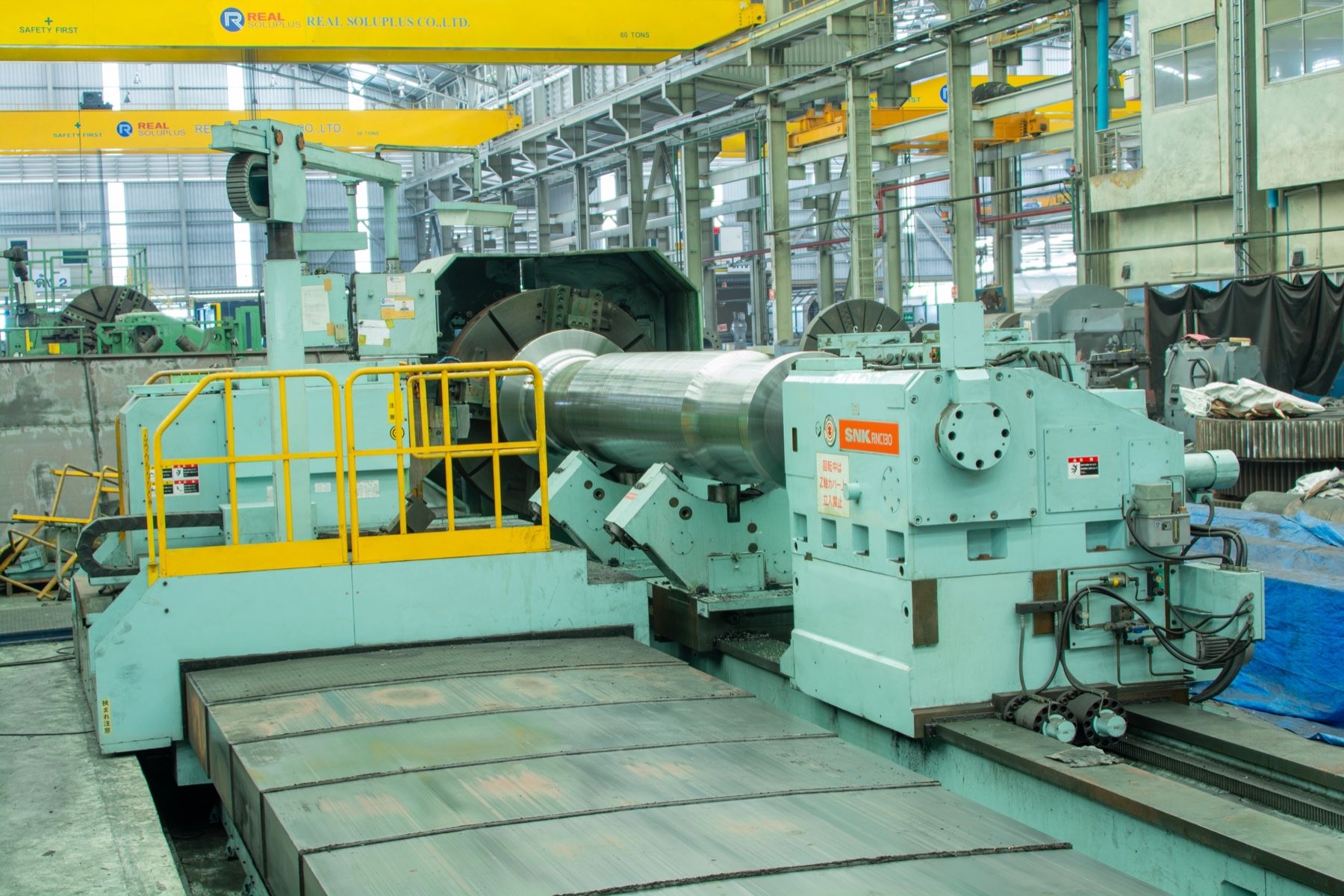 Shin-Nippon RNC-130 CNC lathe machining a large mill shaft